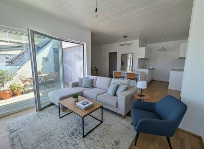 Coole Dachgeschosswohnung mit Terrasse in Holzbauweise