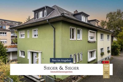 Kapitalanlage in Troisdorf: Dreiparteienhaus mit Garagen