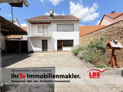 Charmantes Einfamilienhaus mit Werkstatt, zusätzlichem Wohnhaus und üppigem Garten – viel Potenzial