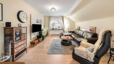 Exklusives Wohnen im Dachgeschoss – Charmante 3-Zimmer-Wohnung mit Garten und Garage