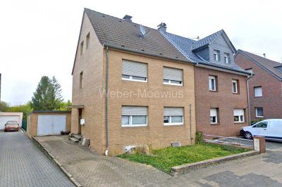 Einseitig angebautes Einfamilienhaus mit viel Potenzial, Garage und großem Garten