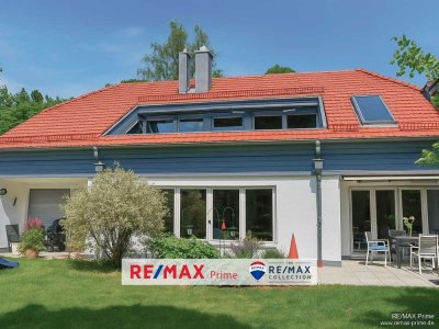 Grünwald: Stilvolle Architektur in Toplage – Villenhälfte in Waldrandlage