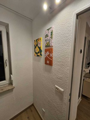 Erstbezug nach Sanierung mit Balkon: Exklusive 1,5-Zimmer-DG-Wohnung mit gehobener Innenausstattung
