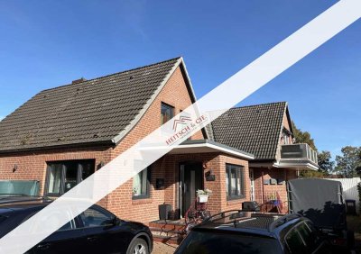 Attraktive 2 bis 4-Zimmer-Wohnung mit Sauna, Garten, Garage und wohnlich ausgebautem Souterrain!