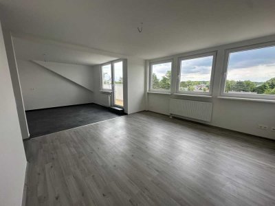 Exklusiver Neubau: Elegante Dachgeschosswohnung in Toplage