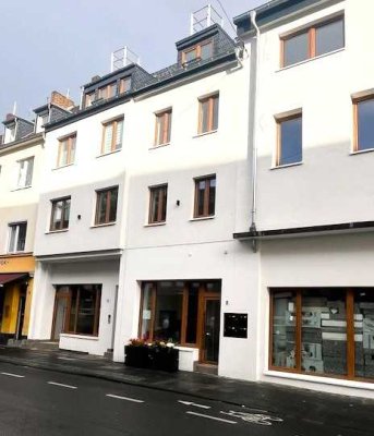 Charmante 38 m² mit Balkon in Bestlage – direkt am Rathaus & Unischloss – KfW 0,75 %