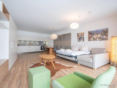 Attraktive Anlegerwohnung: Exzellente 71 m² Gartenwohnung im EG mit Südterrasse &amp; Planai-Blick