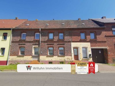 Reihenmittelhaus mit Nebengelassen und schönem Grundstück in guter Lage zum individuellen Ausbau
