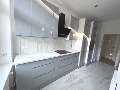 Erstbezug nach Kernsanierung Moderne 2-Zimmer-Wohnung mit sonnigem Südwestbalkon in ruhiger Lage