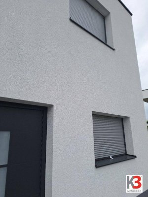 K3 - LEISTBARER LUXUS. Traumhaftes Einfamilienhaus im Erstbezug. Hochwertige und elegante Ausführung. Doppelhausanlage. Unverbaubarer Fernblick.