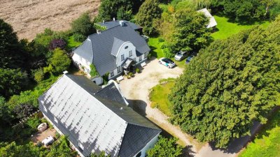 Außergewöhnliches Anwesen mit 4 vermieteten Wohneinheiten –Ihr Refugium inmitten der Natur