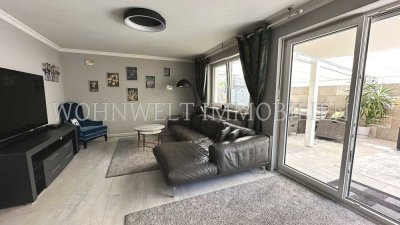 Traumhafte 4 Zi. EG-Wohnung mit Wintergarten