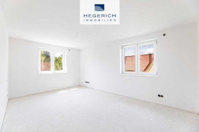 HEGERICH: Erstbezug - Lichtdurchflutete Neubauwohnung mit Aufzug und Balkon