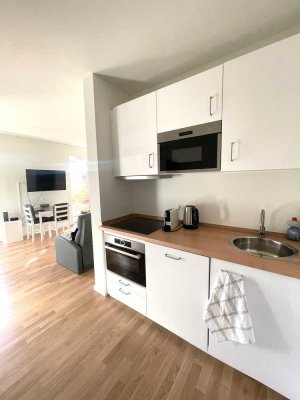 Möblierte 1-Zimmer-Neubauwohnung mit Südterrasse und Gartenanteil