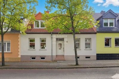 "Charmantes Reihenhaus im Herzen der Stadt: Ihr Raumwunder mit gemütlichem Garten"