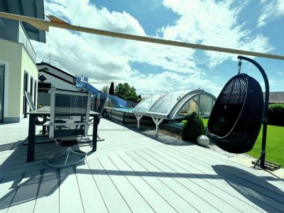Modernes Einfamilienhaus mit beheiztem Pool: Spitzenenergieeffizienz mit nur 12 kWh/m²