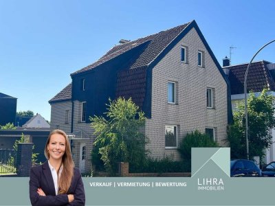 Stadtnahes Zweifamilienhaus mit großer Lagerhalle, Garage und schönem Garten!
