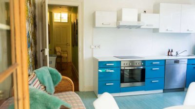 Charmante Dachgeschosswohnung mit Loggia und Garten in ruhiger Lage