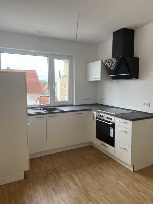 Lichtdurchflutete Neubauwohnung mit großer Dachterasse und TG-Stellplatz