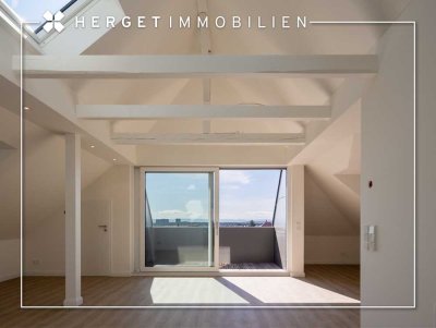 Erstbezug: Loftartige 2,5-Zimmer-Wohnung mit Einbauküche, Balkon & Traumblick