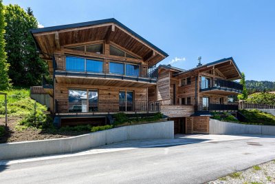 Edle Chalets in „Ski-in &amp; Ski-out“-Lage mit imposanten Kaiserblick