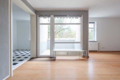 Attraktive Wohnung mit Balkon und TG Stellplatz in zentraler, grüner Lage