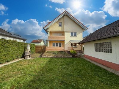 Erdgeschosswohnung mit Garten, Doppelgarage und Kellerraum