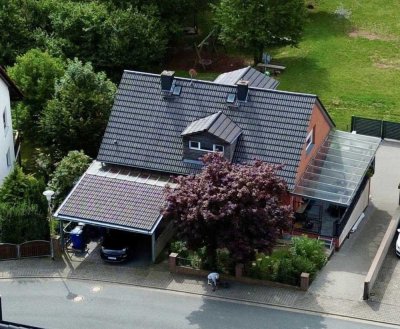 Einfamilienhaus mit Einliegerwohnung und Garten in idyllischer Lage