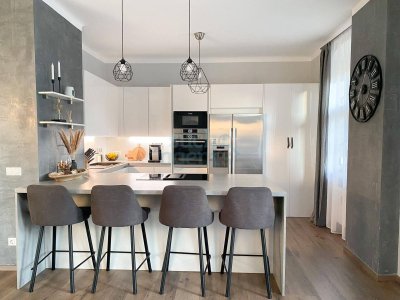 Renovierte Gartenwohnung mit 386 m² Eigengarten, Balkon und zwei Stellplätzen – Nähe Haid-Center