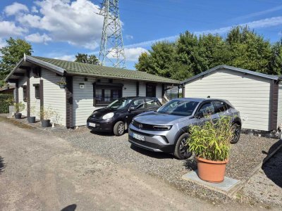 Gemütliches 3,5 Zimmer Holzblockhaus mit Wintergarten & Nebengebäude mit 77 m²