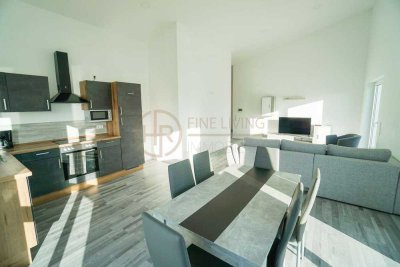 DG-Wohnung mit großem Balkon und Top-Aussicht! Energieeffizienz A+ plus PV-Anlage!