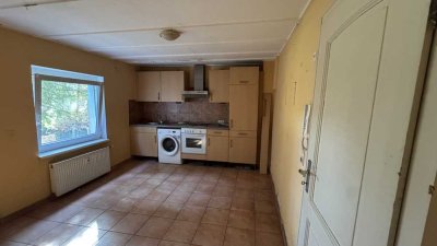 Gemütliche 1,5-Zimmer-Souterrain-Wohnung  mit Einbauküche, Terrasse, Gartenanschluss und Parknähe