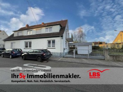 Charmantes Einfamilienhaus mit Garage und gepflegtem Garten