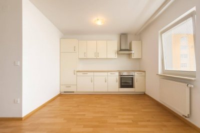 Clever investieren: befristet vermietete 1-Zimmer-Wohnung und Tiefgaragenplatz mit 4,4% Rendite