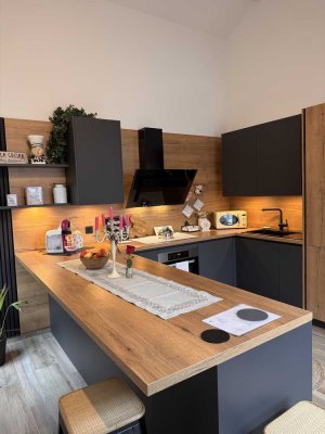 Moderne DG-Wohnung mit Einbauküche und Dachterrasse in Tecklenburg lässt keine Wünsche offen