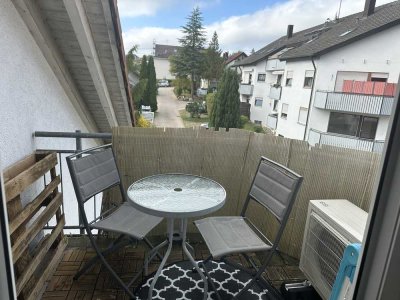 Stilvolle 2,5-Zimmer-Eigentumswohnung mit Balkon, Einbauküche und zwei Tiefgaragenstellplätzen