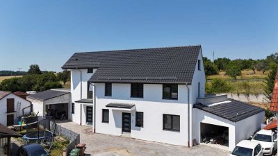 Exklusiver Neubau: Freistehendes Einfamilienhaus mit separater Einliegerwohnung