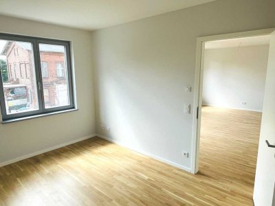 Helle 2 Zimmerwohnung mit offener Einbauküche und Tiefgaragenstellplatz
