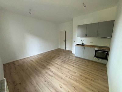 Lichtdurchflutete 1-Zimmer-Wohnung im Erdgeschoss mit Einbauküche - ERSTBEZUG