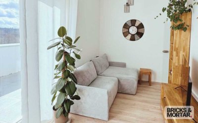 2-Zimmer-Penthouse in ruhiger Ortsrandlage mit traumhafter Aussicht