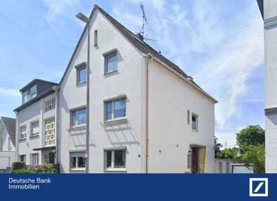 Mehrfamilienhaus mit Gewerbeanbau, Doppelgarage und Garten