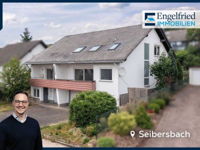 Solides Zweifamilien-/Doppelhaus mit reichlich Platz, tollem Ausblick, Garten und Garagen