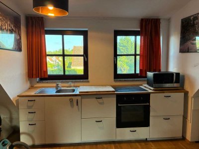 Möblierte 1,5-Zimmer Dachgeschosswohnung mit Garten in Berlin Heiligensee