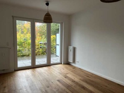 Schicke 1-Zimmer-Wohnung mit Einbauküche im Neubau (EG) + Außenstellplatz!