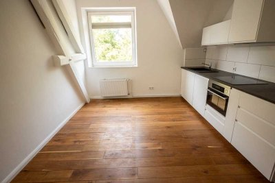 Zentral & stilvoll: 1-Zimmer-Wohnung im Altbau