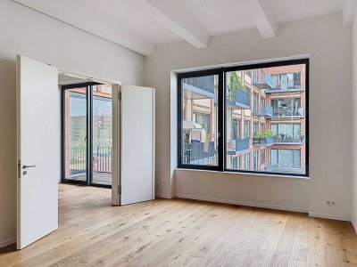 Großzügiges Wohnen im historischen Gebäude nahe Europa-City: Bezugsfreie Loft-Wohnung mit Balkon!