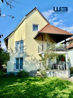 Großzügiges Mehrfamilienhaus mit 3 Wohnungen, Garten, Doppelgarage & 4 Stellplätzen in Top-Lage