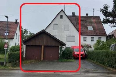 ausbaufähiges Einfamilienhaus mit Einliegerwohnung & Doppelgarage
