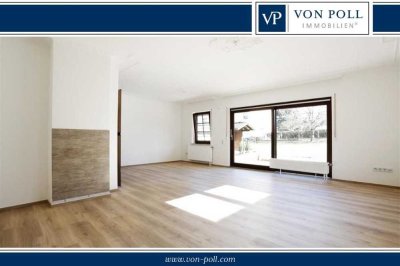 Lichtdurchflutete Erdgeschosswohnung mit Terrasse und eigenem Gartenanteil