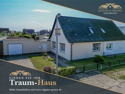 Gemütliche Doppelhaushälfte mit Wintergarten und separatem Gäste-Bungalow